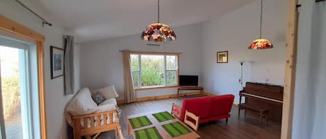 Living room with TV & piano