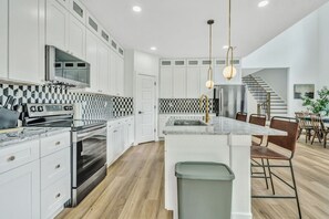As you step into the kitchen, the clean lines and functional design make you eager to start cooking your favorite dishes.