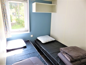 A minimalist yet welcoming bedroom setup.
