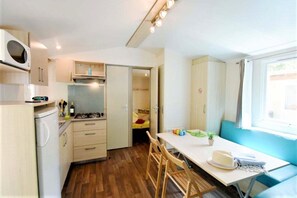 A bright, fully-equipped tiny home kitchen.