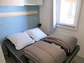 A cozy bedroom with soft lighting
