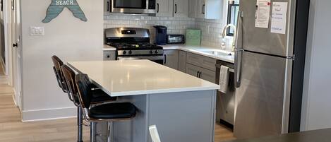 Kitchen with Island seating for 3