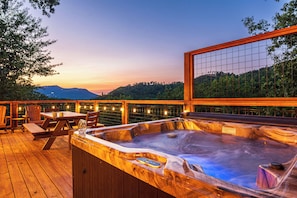 Relax and unwind in the hot tub after a long day in town and soak in the view