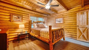 Primary bedroom on main floor queen size bed.