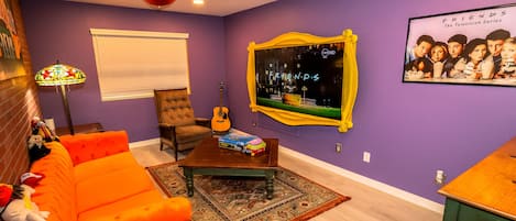 unwind watching T.V through our peephole T.V frame in our friends theme room 