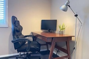 Office with desk, chair and monitor