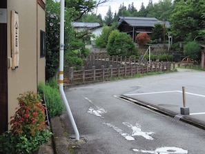 The promenade along the river continues from the entrance.