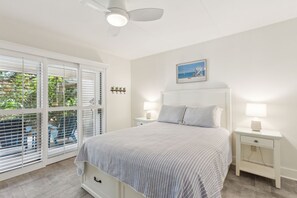 Master Bedroom with a Flat Screen Smart TV, Sliding Glass Doors to Covered Patio, and Attached Master Bath (Queen Bed)