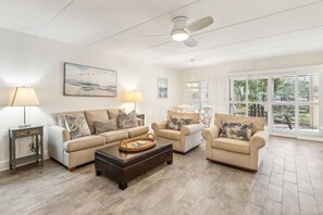 Sunny Living and Dining Area with Sliding Glass Doors to Covered Patio