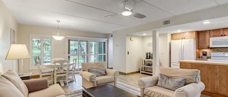 Sunny Living and Dining Area with Sliding Glass Doors to Covered Patio