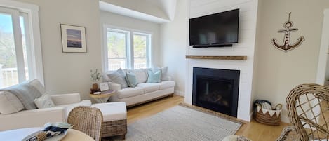 Living room with comfortable seating and gas fireplace  