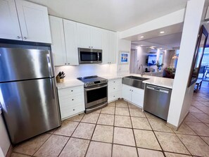 Smooth and shiny granite countertops make this the perfect space for serving!