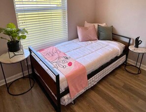 Bedroom 4: Perfect for kids or guests, our twin trundle room is a charming and versatile space for sleep or play.