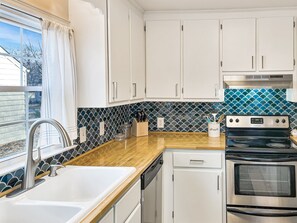 This well stocked kitchen with modern, updated appliances and plenty of prep space makes mealtime easy. Bonus! A dishwasher for easy clean up too!