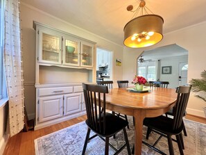 The dining room is off the kitchen and living room which makes for great flow when visiting with friends + loved ones.