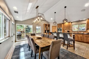 Large dining and gourmet kitchen - Large dining for 8 at the table, 4 at the bar, in the open concept gourmet kitchen