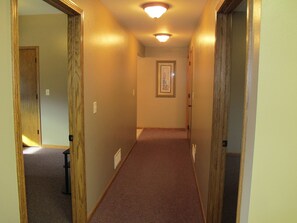 Private BRs on each side of hall with lg. linen closet near RR at end of hall