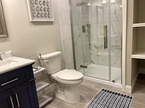 Beautiful Bathroom with Upgraded Fixtures. Also equipped with a fan and heater.