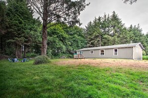 Let your pets frolic in the backyard amid the towering alpine trees