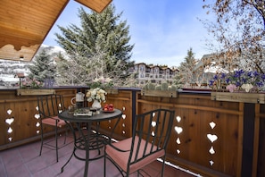 Just off the master bedroom is this charming private bistro patio with views of the Wasatch Back and the beautiful grounds of Zermatt