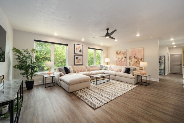 Gathering Room with large windows and sofa sectional 
