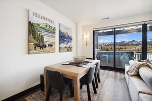 Large wood table with leather chairs and large bench for family gatherings