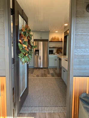 Covered entrance to Kitchen in Main House.