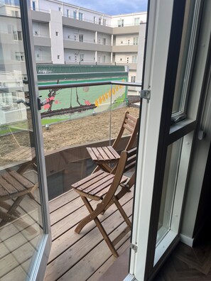 Kitchen and living room connect and have a balcony