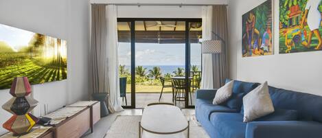 Living room with garden/ocean views
