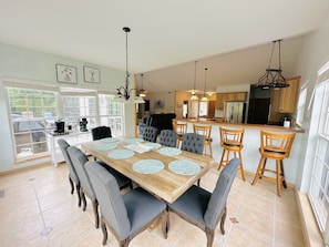 Beautiful dining set up just right across the spacious kitchen