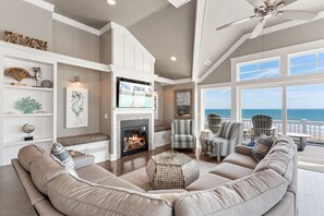 Living area with stunning ocean views (*Please Note: The fireplace is not for guest use)
