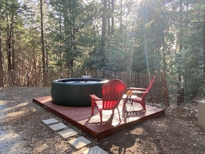 Hot tub paradise surrounded by huge pine trees. Secluded and romantic.