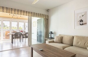 Living room looking out to conservatory