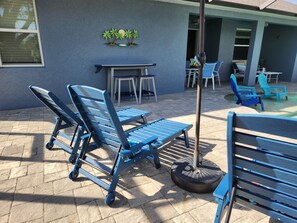 Pool loungers, beach towels and drinks with the little tropical umbrellas.