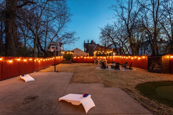 Backyard at night with string lighting