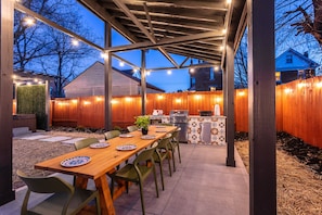 Huge covered outdoor dining table and kitchen
