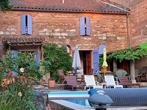 view of the back of the house and patio