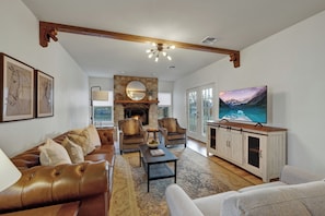 Cozy up to the fireplace in this beautifully decorated living room.