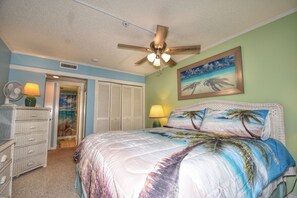 King Master Bedroom with a beautiful beach theme and private balcony to enjoy!