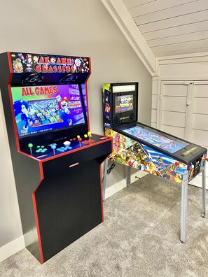 Retro arcade & electronic pinball table in loft