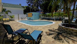 Extra lounge seating, shady seating under palm trees. Butterfly garden!
