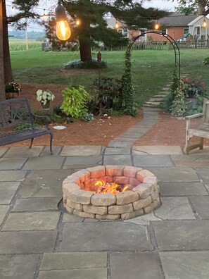 Enjoy relaxing around the firepit at the outdoor patio.  