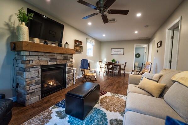 The Living Room features a gas fireplace and a 49" TV to stream your shows.