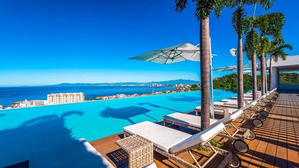 [Rooftop] Plush lounge chairs for relaxing in comfort.