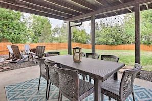 Dine al fresco on the patio’s outdoor table for 8 and cook on the gas grill