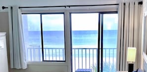 Living room beachfront view and Balcony view.
