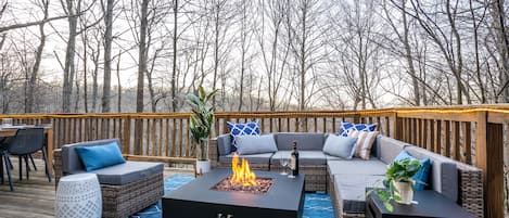 New patio furniture and propane fire table on the upper deck.