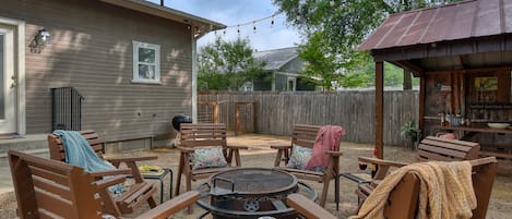 Backyard oasis with  Texas sized fire-pit and outdoor dining area and fire pit!