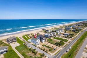 Prime oceanfront placement with direct beach access and wide, uncrowded shoreline just steps away.