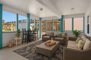 The Command Deck - Screened Porch - Enjoy shaded relaxation and ocean breezes in the fully screened porch — perfect for morning coffee or evening chats.